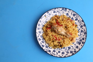 plate of rice with chicken and peppers