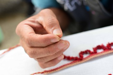 Working hands weavers of threads and hoops