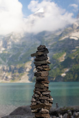 stone pyramid on a lake coast