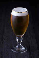 Lager beer placed at black background.