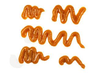 Orange sauce splashes isolated on white background