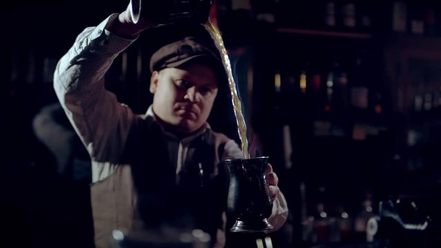 Cooking burning punch or grog.  It can be a &ldquo;Blue Blazer&rdquo; punch.  The footage is recorded at 60 frames per second, and you can slow it down. 