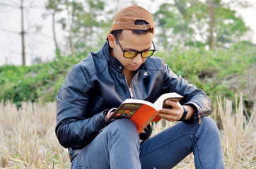 Young boy reading book