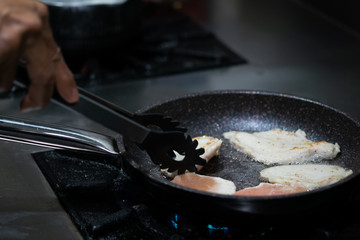 chicken fillet fried on frying pan