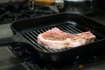 Grilled pork chop .Steak on a frying pan