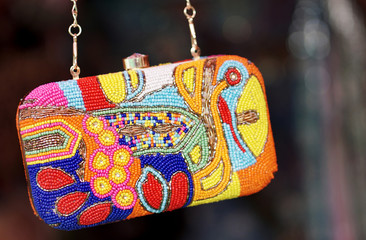 Closeup of Indian woman fancy hand bags or purses ,handmade in display of a shop