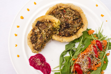 Plant-based food on white plate.
