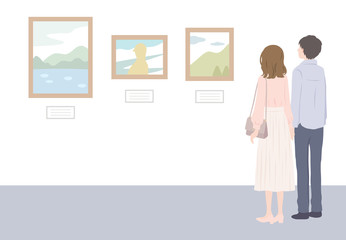 美術館で絵画鑑賞するカップル