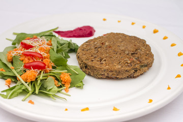 Plant-based food on white plate.