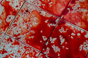 Blood spatter on dirty floor for scary crime scene .