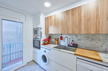 modern kitchen, with a touch of wood, with a balcony
