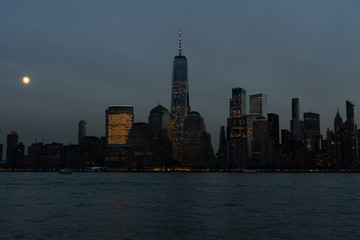 Dark Lower Manhattan New York City Skyline at Night with the Moon