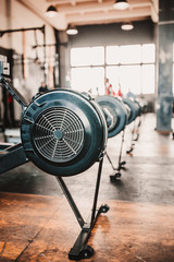 Early morning at the gym - exercise equipment against the bright sun from the window
