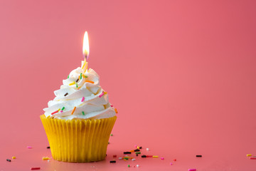 Homemade Birthday cupcake on pink Background.