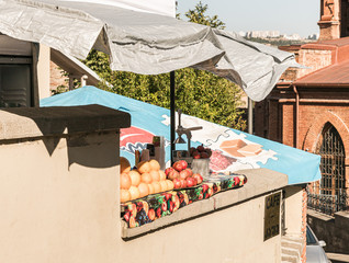 Freshly squeezed juice shop near his house in old part of Tbilisi city in Georgia