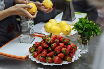 red fresh strawberries lying on the plate