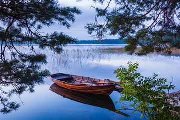 Wooden boat on lake Finnsjön, Sweden © Mikael