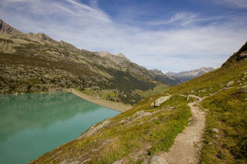 Naklejka na ściany i meble Dam impounding lake Goeschenen in the Swiss alps