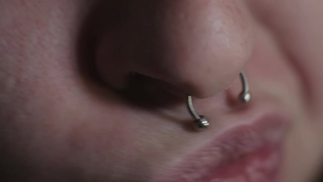 A Fashionist Wearing A Silver Septum Piercing Clicker - Close Up Shot
