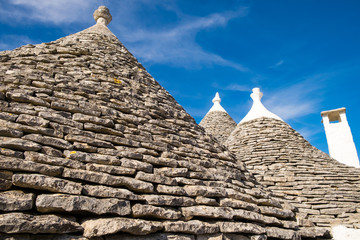 Fototapeta na wymiar Beautiful view of Trulli houses stone roof in Alberobello, Italy