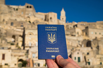 Ukrainian blue biometric passport on against beautiful background.