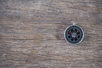 selective focus of compass wooden table,abstract background to travel concept