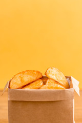 roast potatoes portion on yellow background