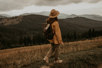  girl walks in the mountains