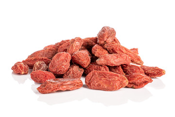 Lot of whole dried red goji stack isolated on white background