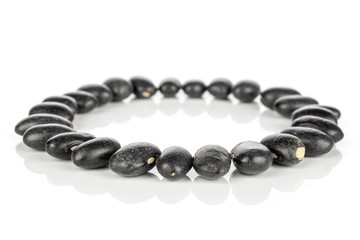 Lot of whole black bean circle isolated on white background