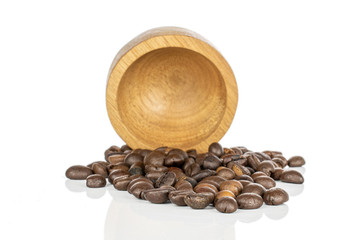 Lot of whole roasted fresh coffee bean in bamboo bowl isolated on white background