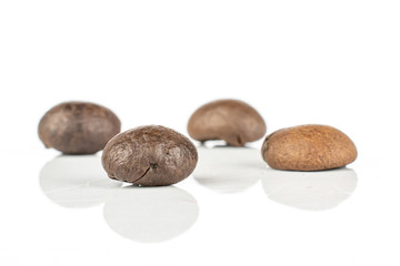 Group of four whole fresh coffee bean isolated on white background