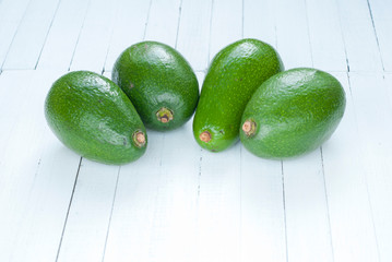 avocadoes on wooden table