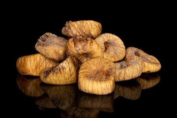 Lot of whole dried fig stack isolated on black glass