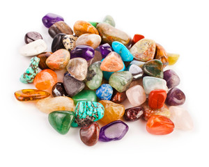 Colorful semiprecious gemstones isolated on a white background.