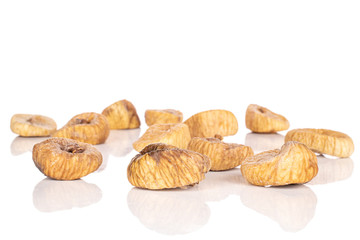 Lot of whole tan dried fig isolated on white background