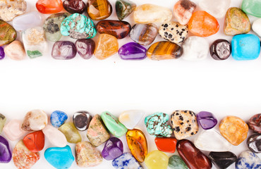 Colorful semiprecious gemstones isolated on a white background.