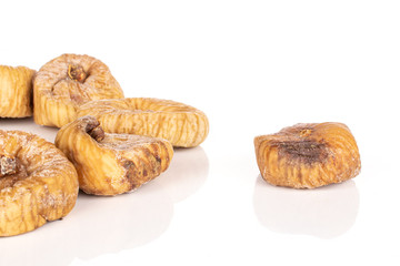 Lot of whole meaty dried fig isolated on white background