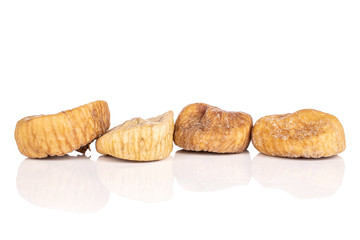 Group of four whole dried fig isolated on white background