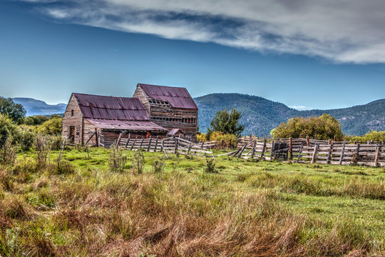 Painterly image of old barn and corral