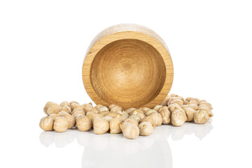 Lot of whole uncooked fresh tan chickpea in bamboo bowl isolated on white background