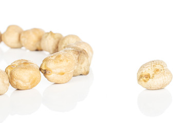 Lot of whole fresh tan chickpea isolated on white background