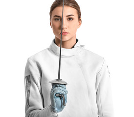 Young female fencer on white background