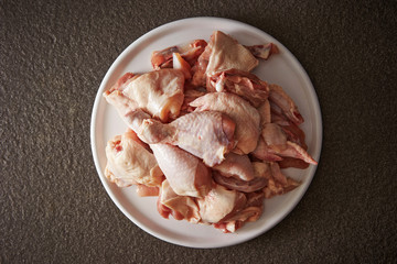 Fresh raw chicken legs on plate