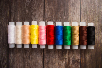 Set of colored threads for sewing on coils