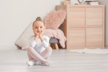 Cute little ballerina at home