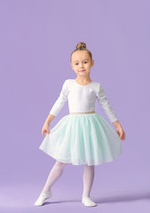 Cute little ballerina on color background © Pixel-Shot