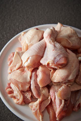 Fresh raw chicken legs on plate