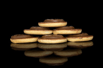Group of six whole chocolate biscuit isolated on black glass
