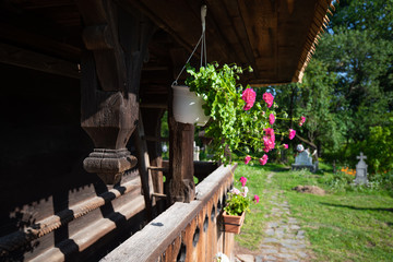 Obraz premium Porch of traditional Maramures wooden church. UNESCO world heritage site. Surdesti, Maramures, Romania